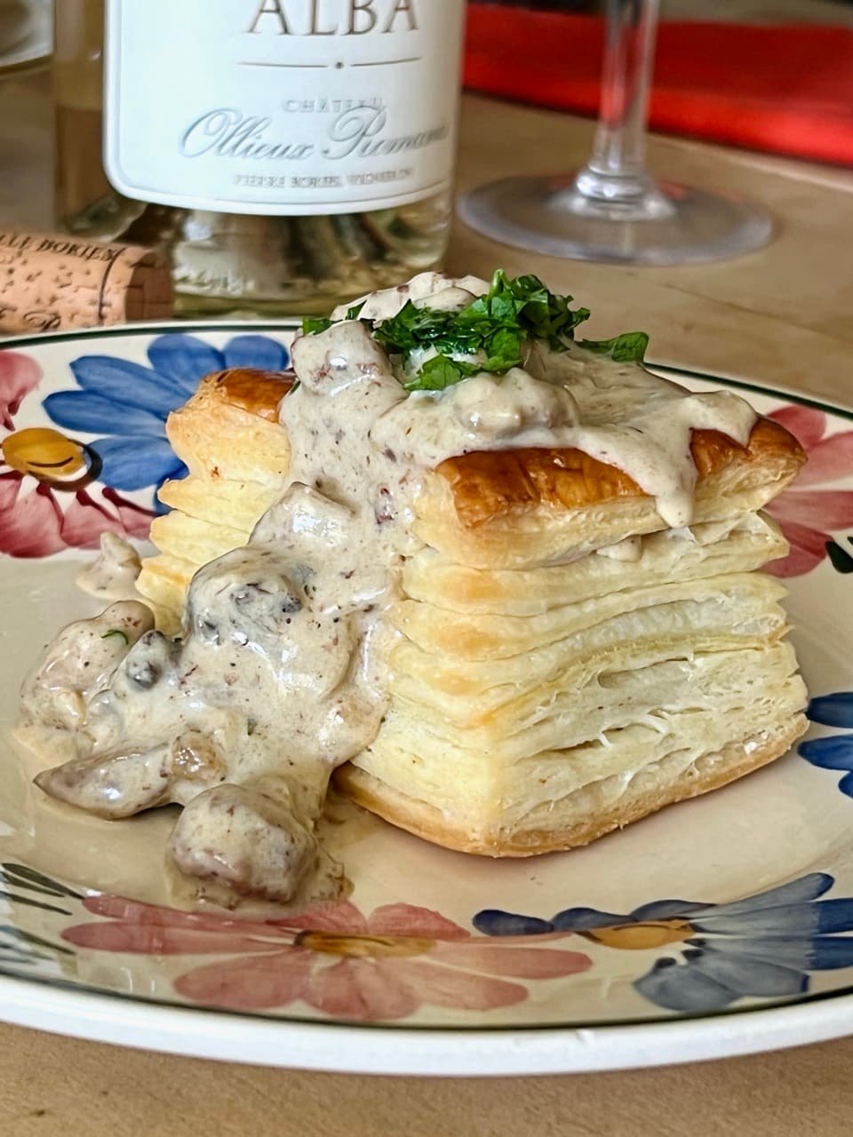Veal sweetbread vol-au-vent on a plate garnished with fresh parsley