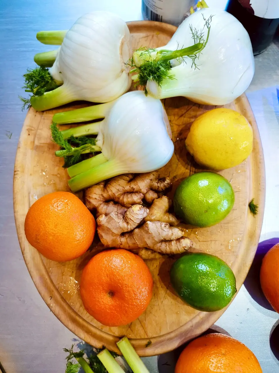 Ingredients for fennel salad on a wooden board