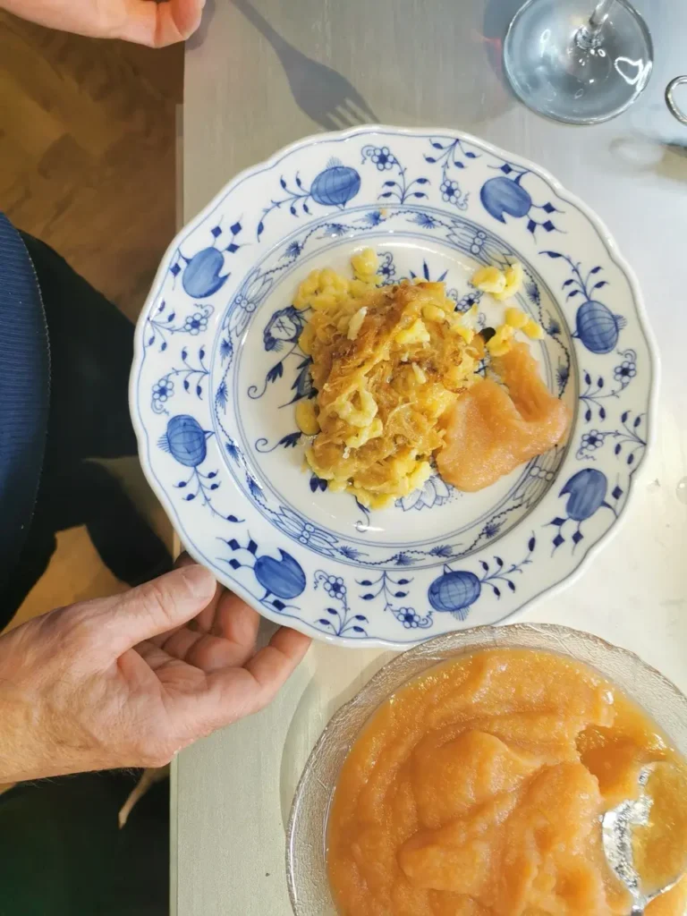 Golden baked cheese spaetzle with apple sauce on the side
